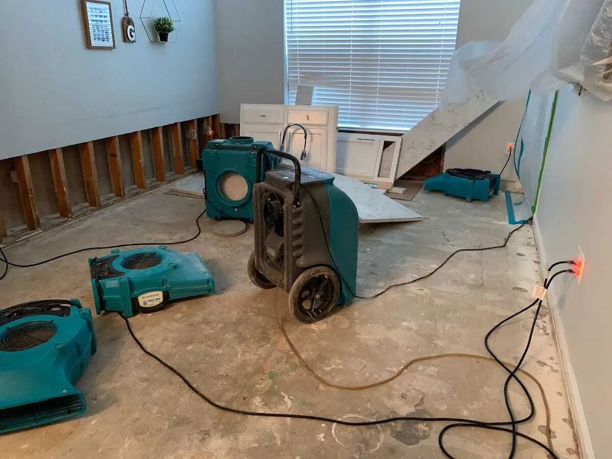 Dehumidifier in flood-cut room for Water Damage Restoration in Greenville